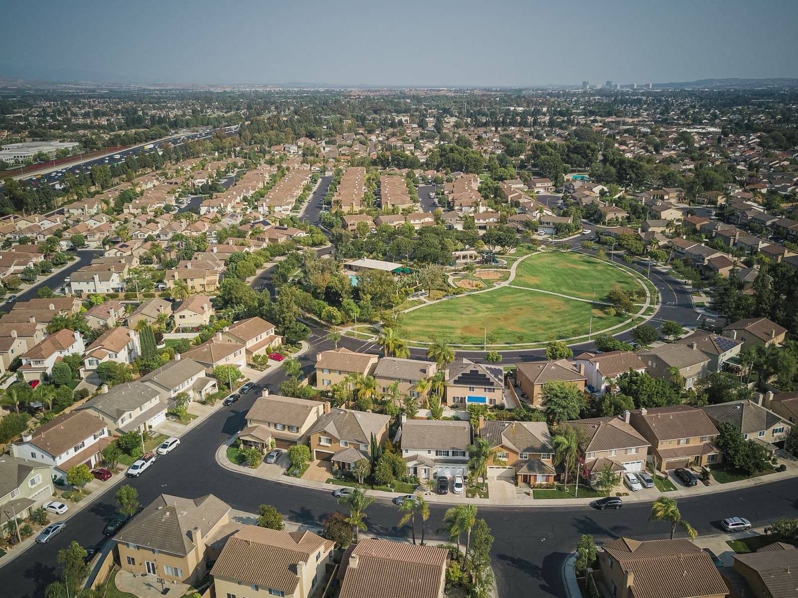 Aerial view of a Sun Belt residential neighborhood built around a central park