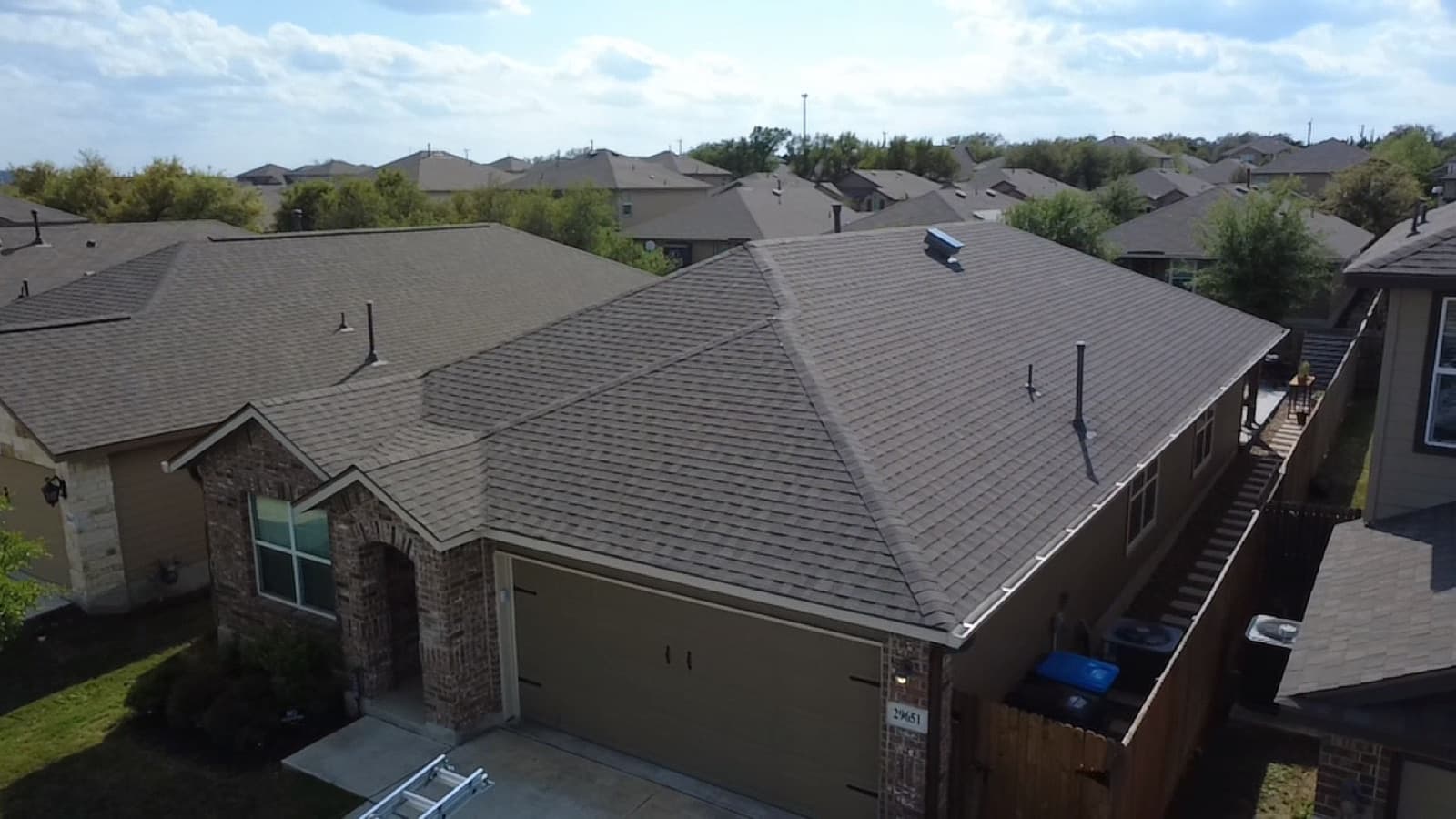 Crew documenting and working a San Antonio roof, the kind of photo report an insurance claim needs