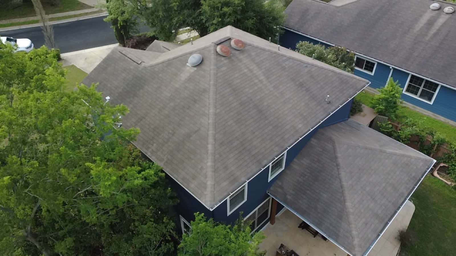 Aerial view of a newly shingled hip roof on a San Antonio home