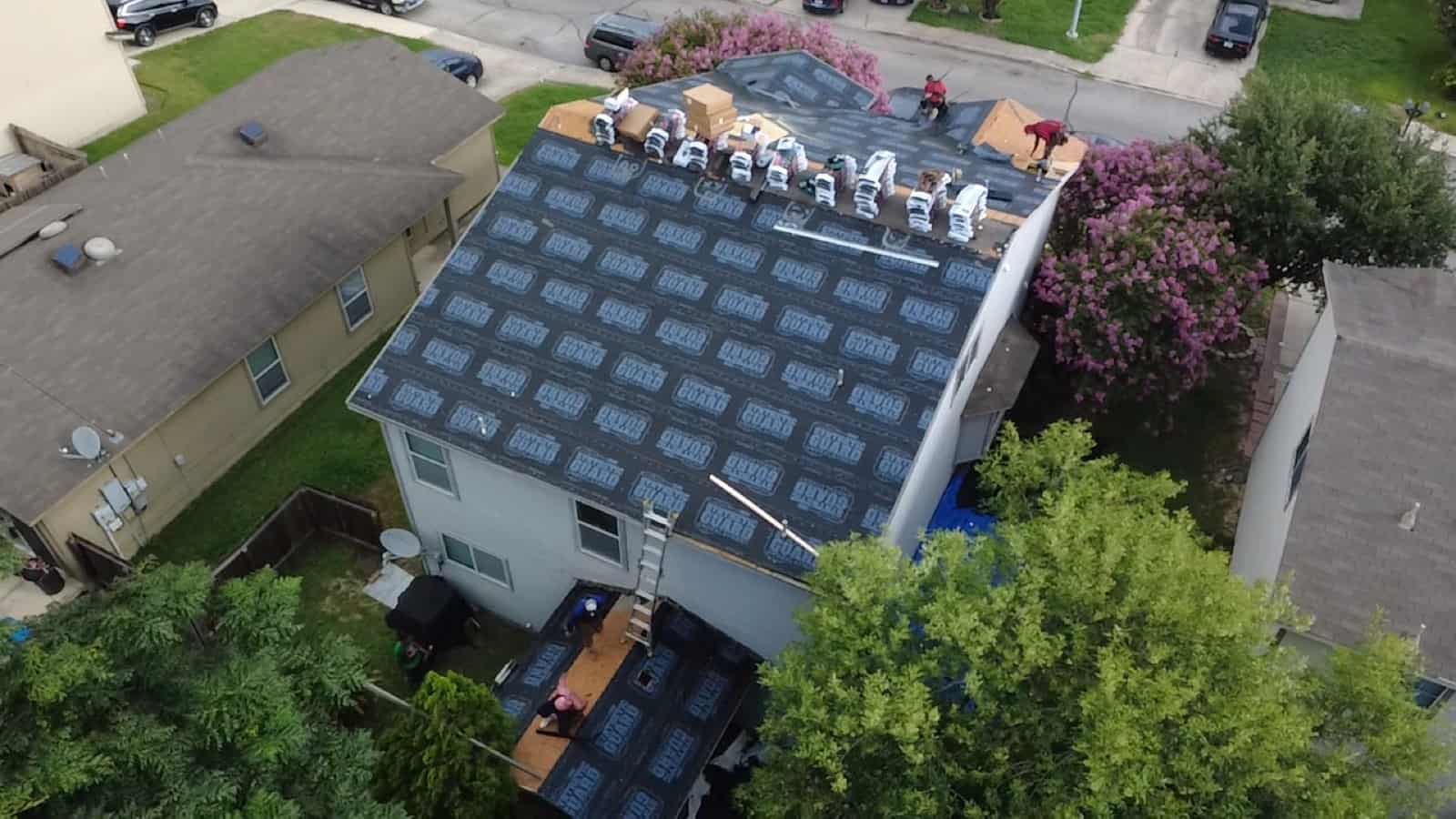 Perfect Balance crew installing a new roof on a two-story San Antonio home
