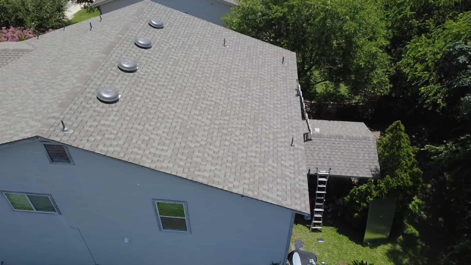 Overhead view of a finished gray architectural shingle roof on a San Antonio home