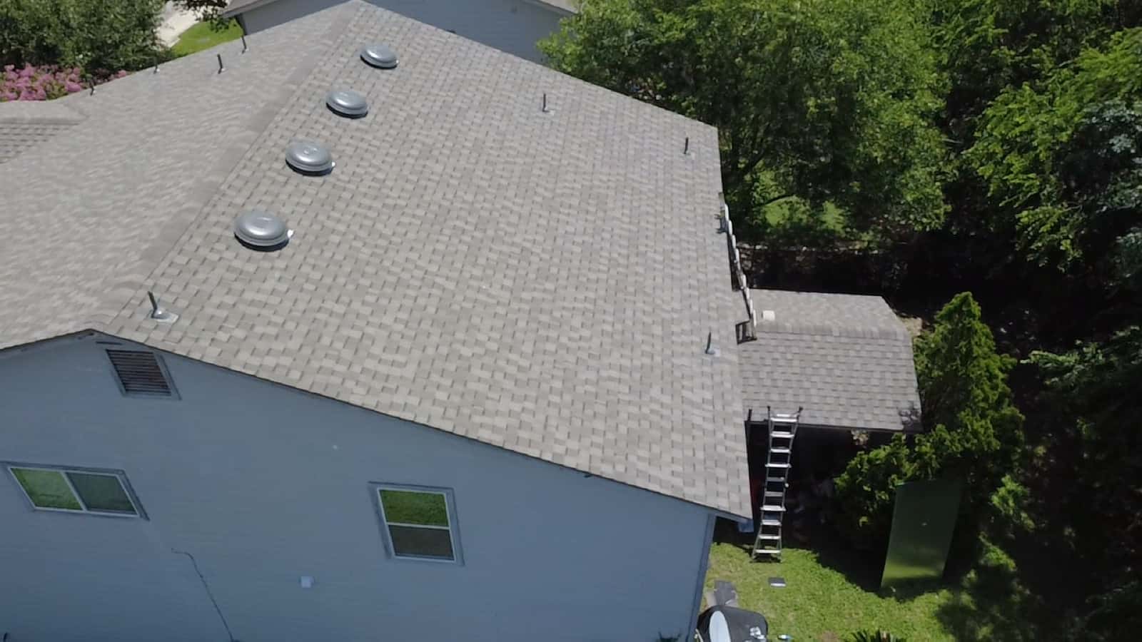 Overhead view of a finished gray architectural shingle roof on a San Antonio home
